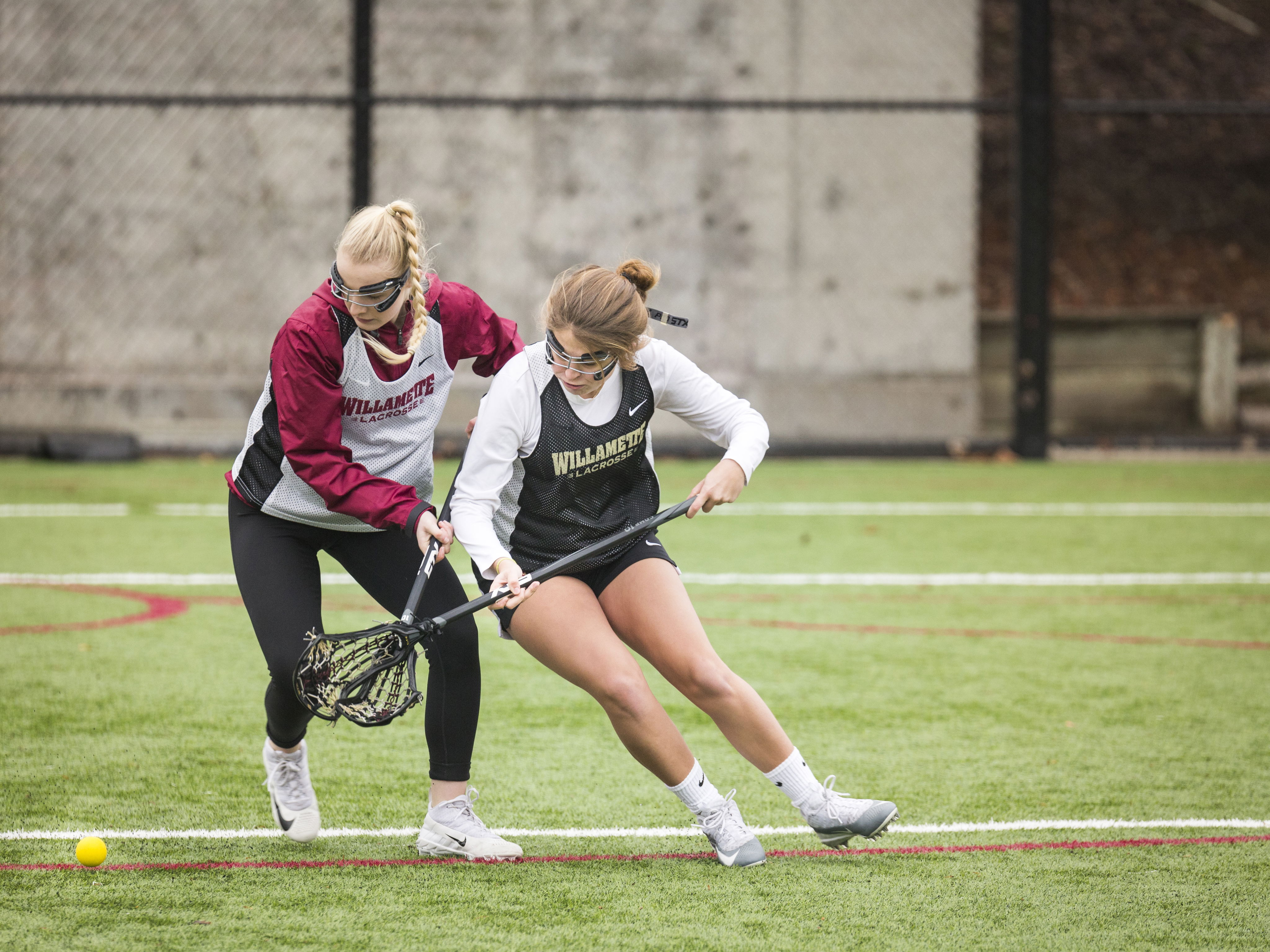 Willamette Women's Lacrosse players on the field.