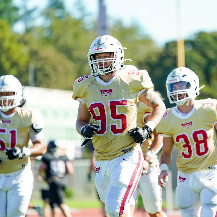 The Willamette University football team on the field in McCulloch Stadium