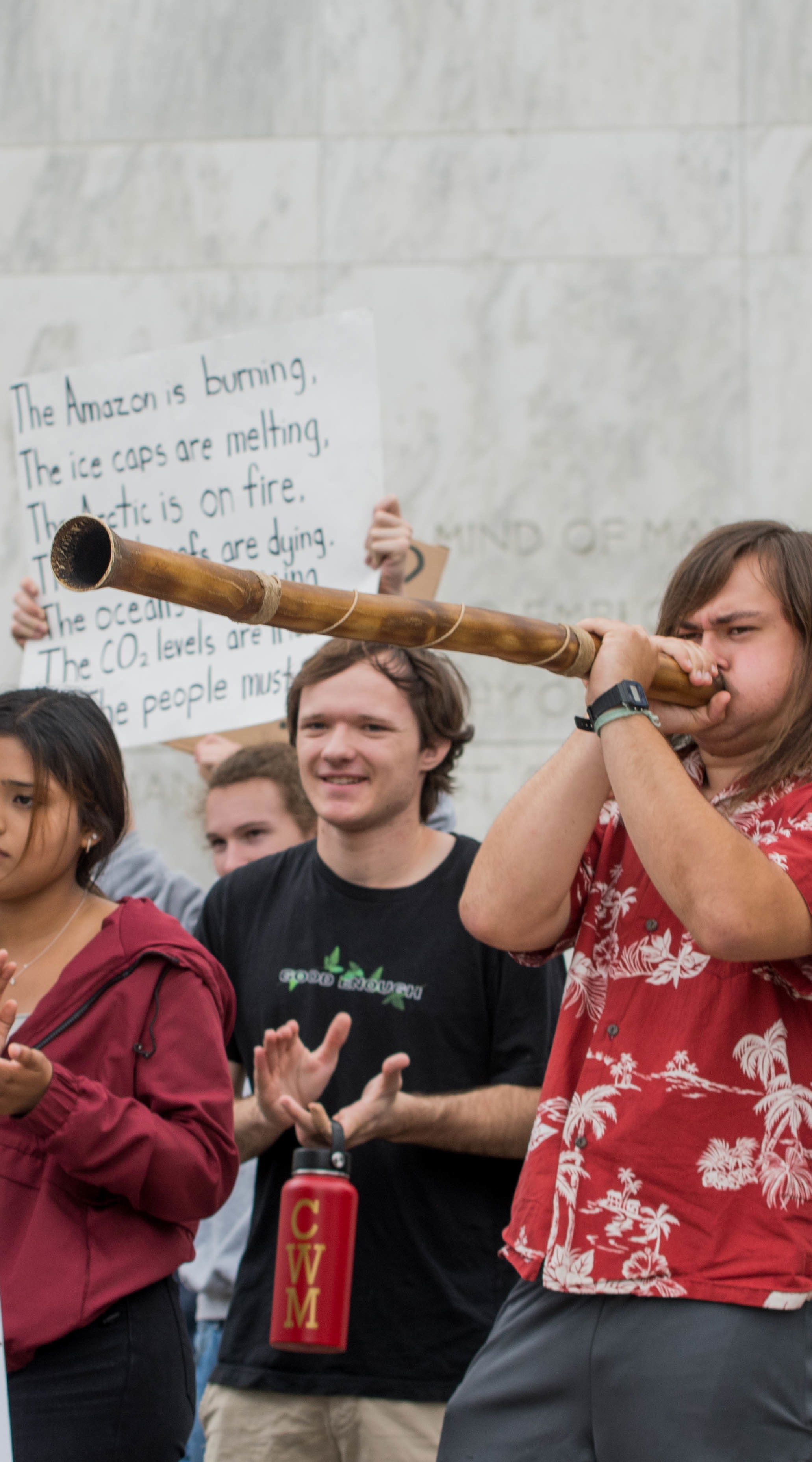 Climate activism, students holding signs and protesting for the earth