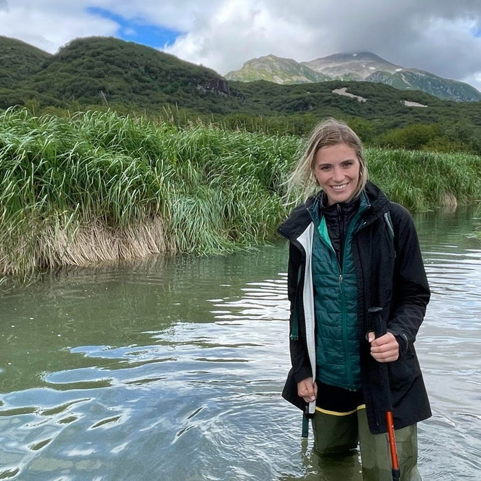 Anelise Zimmer BA’16 standing in a body of water