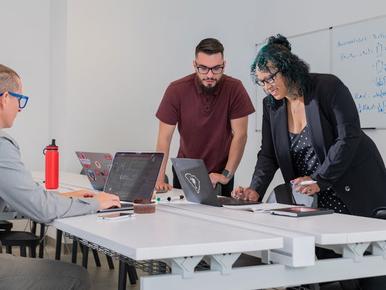 Data science professor and students in a classroom.