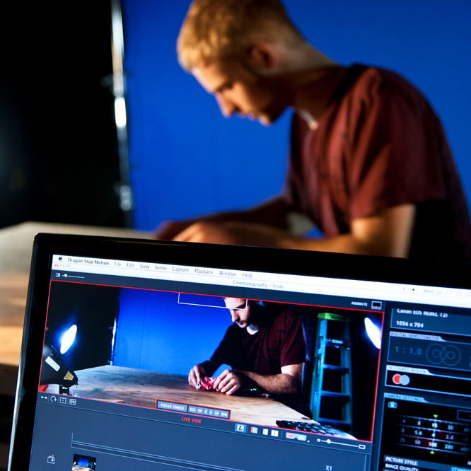 A PNCA student work on an animated arts project in a lab.