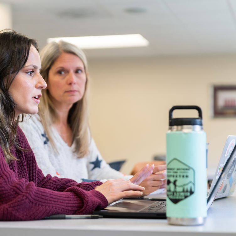 Students sitting at a desk at Willamette University.