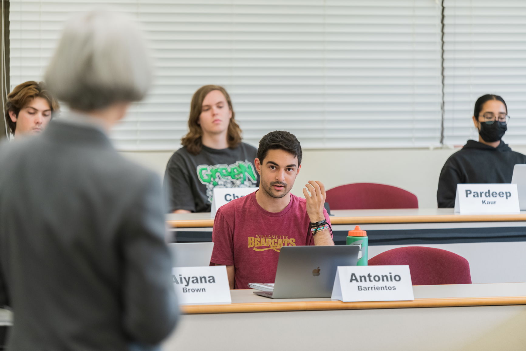 Willamette students in class answering a professor's question. 