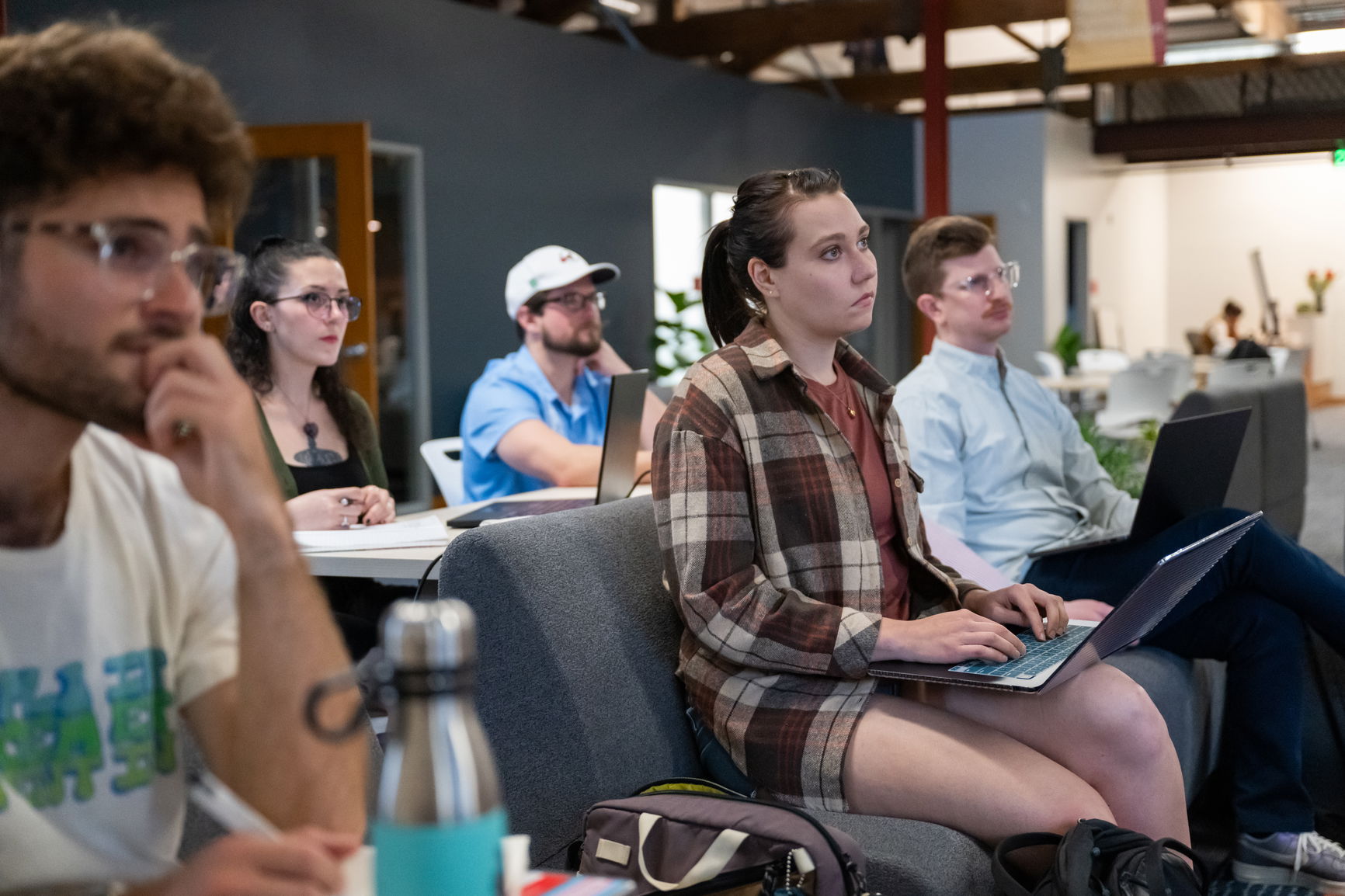 Students in class listening to a lecture.