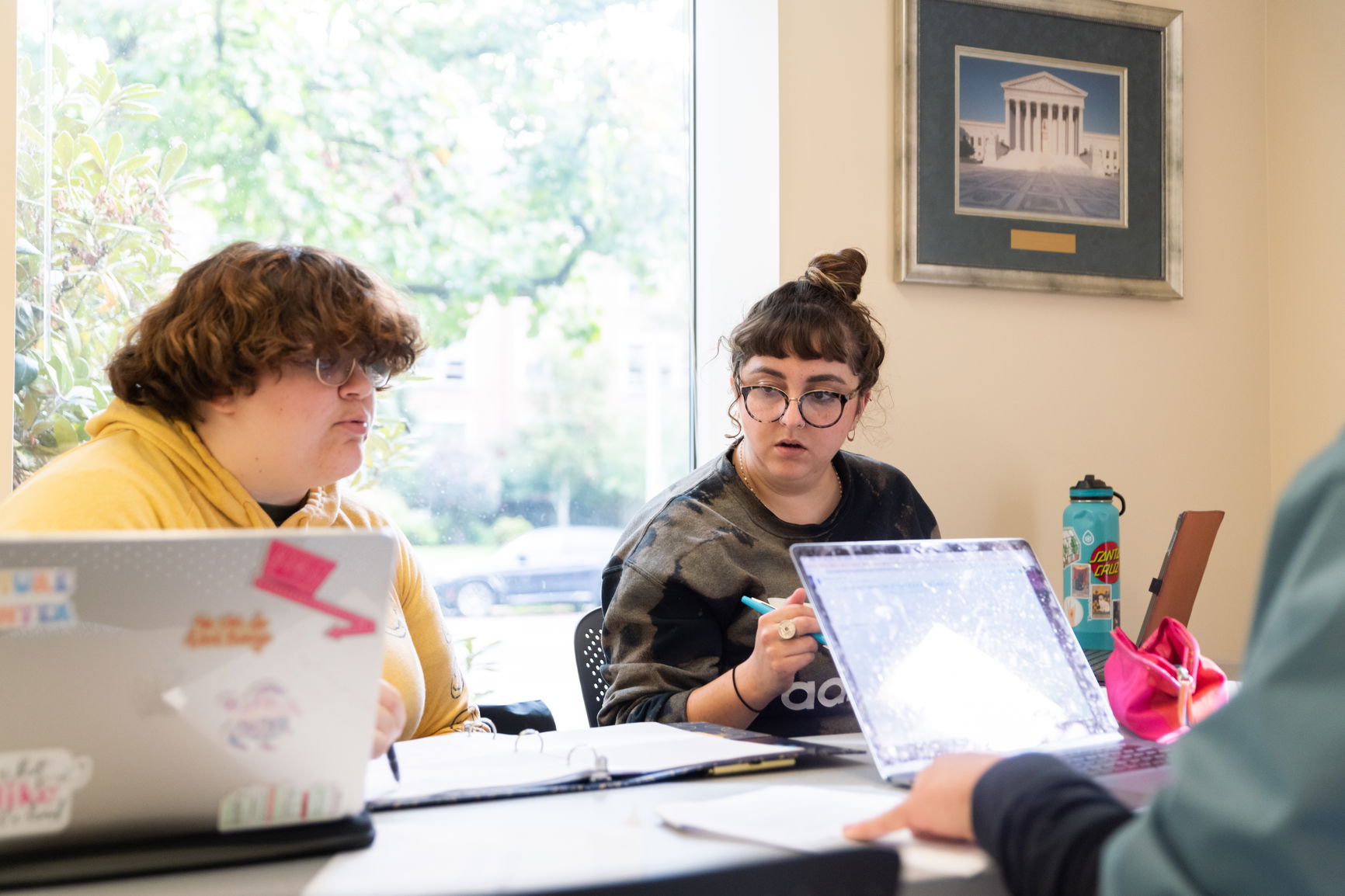 Two law students studying together in a library