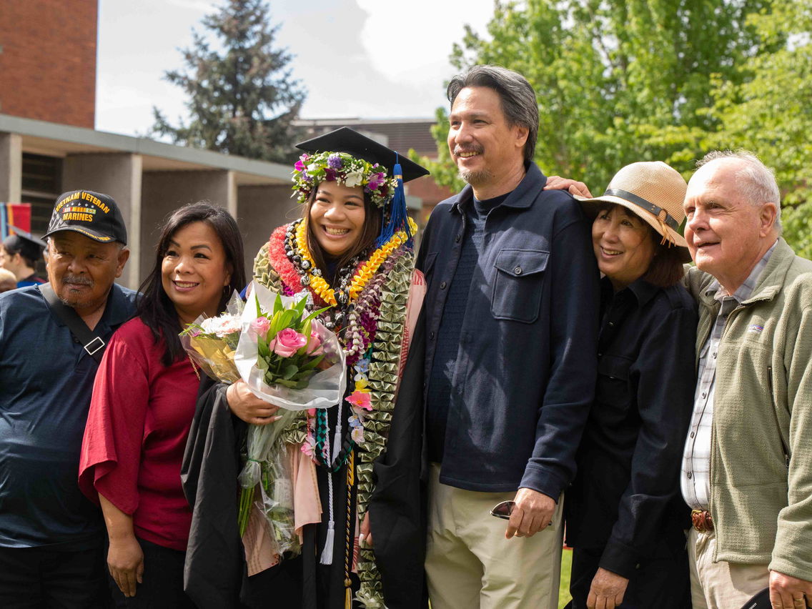 MBA grad and her family at Commencement.