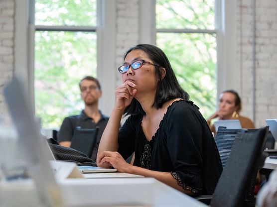 Willamette MBA student listing to a professor's lecture.