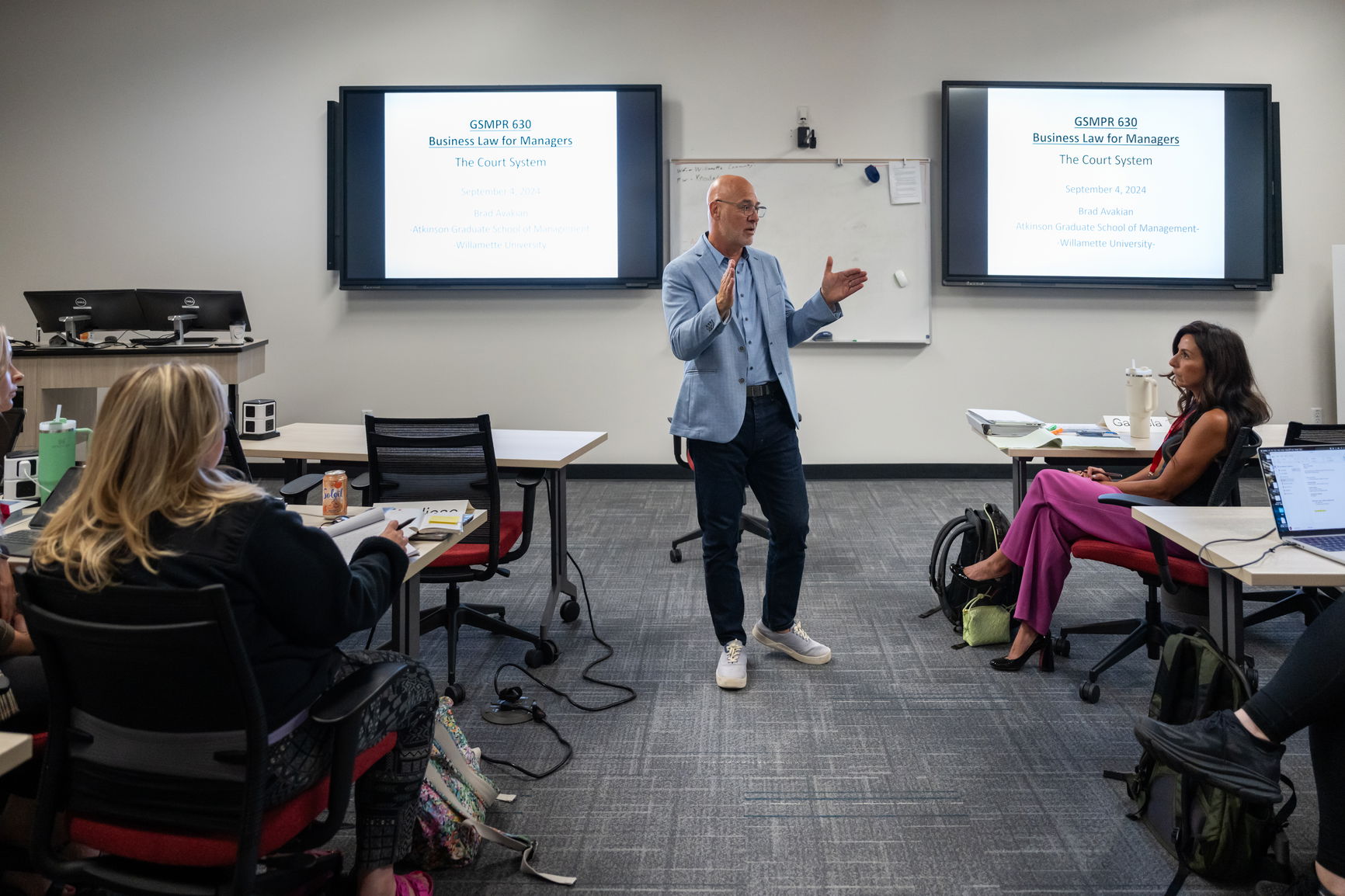 Professor teaching in an MBA classroom