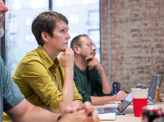 A Willamette MBA student sitting in class paying attention to the day's lesson.