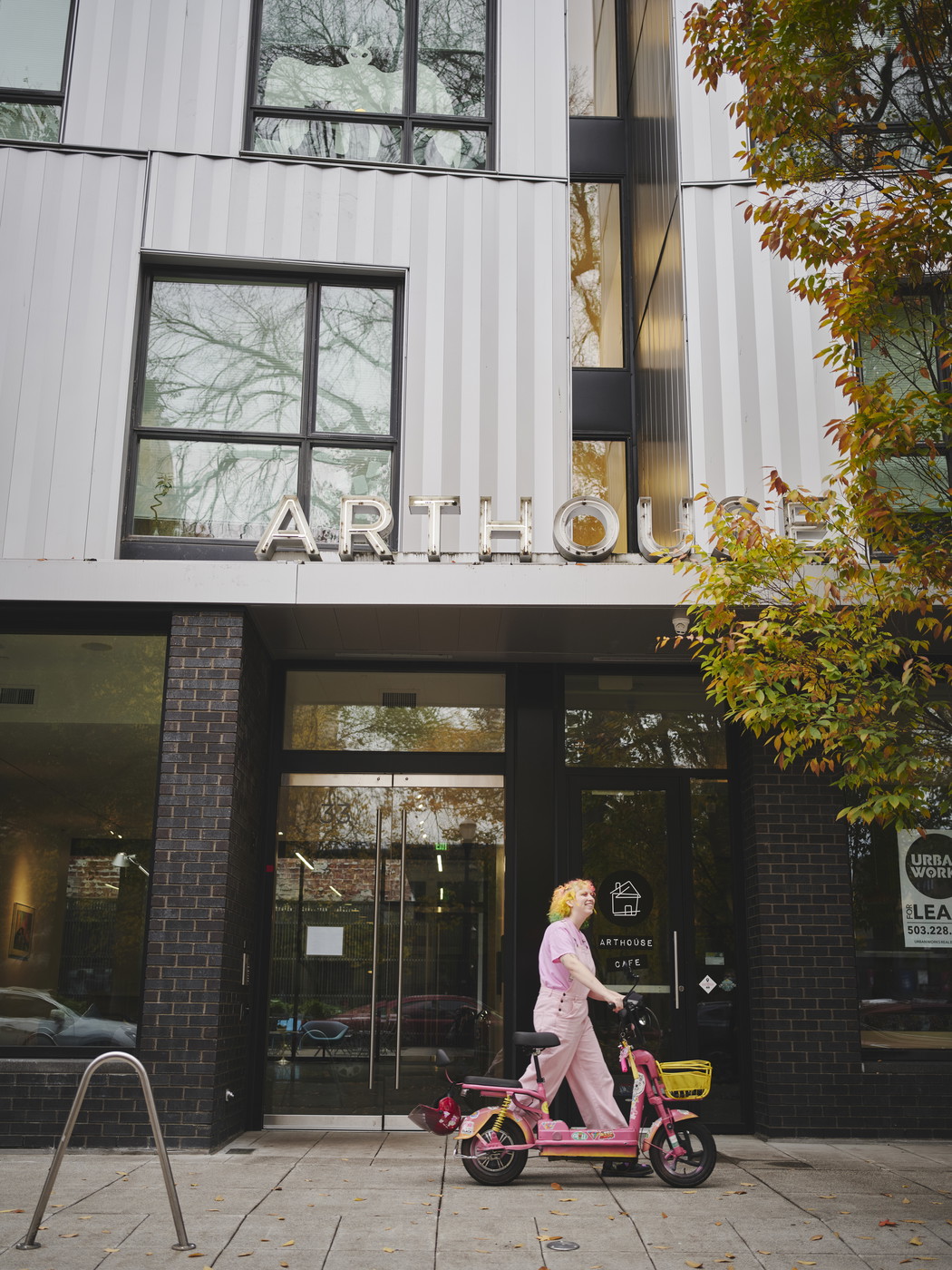 Student standing in front of art house