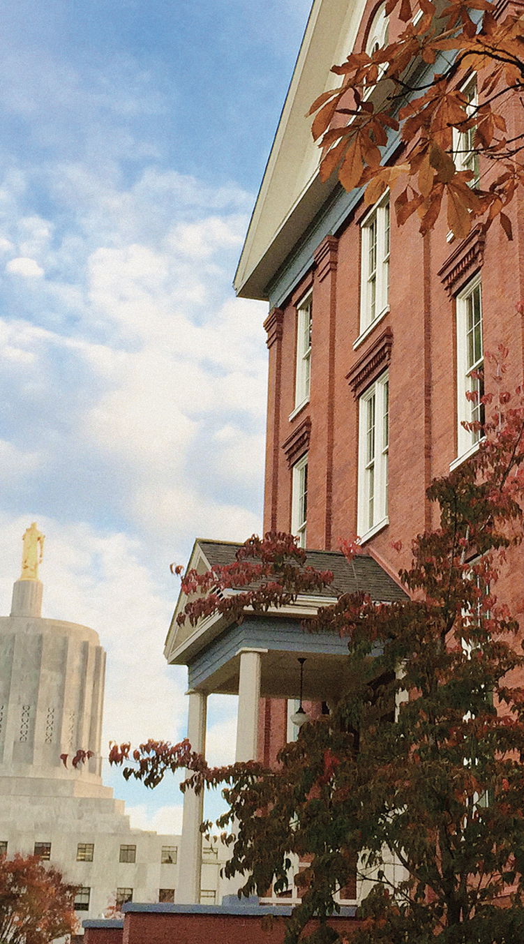 Willamette's Waller Hall at Salem Campus with the Star Trees and Oregon State Capitol in the background