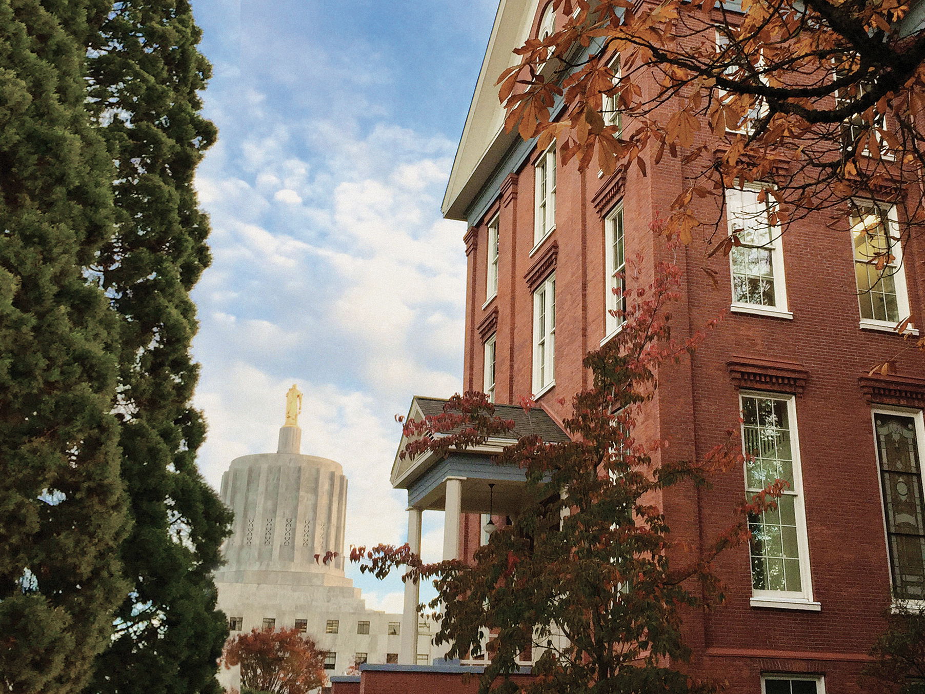 Willamette's Waller Hall at Salem Campus with the Star Trees and Oregon State Capitol in the background