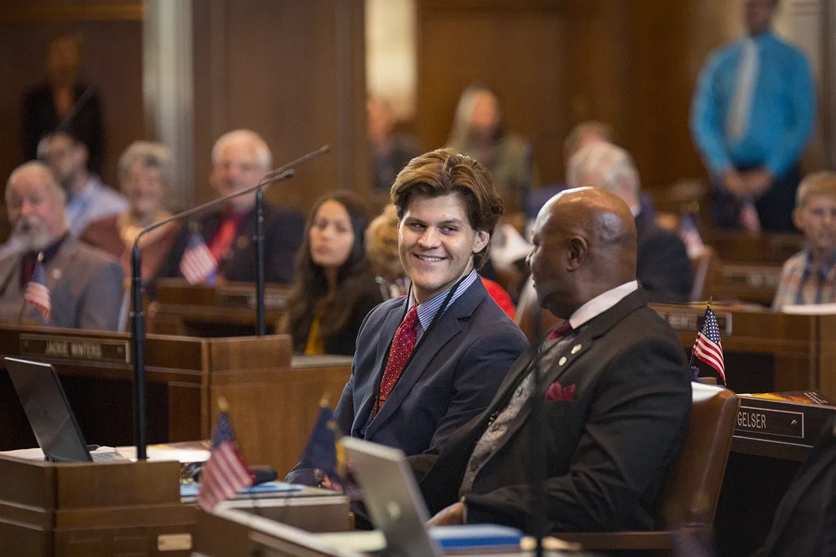 Two people chatting in a courtroom