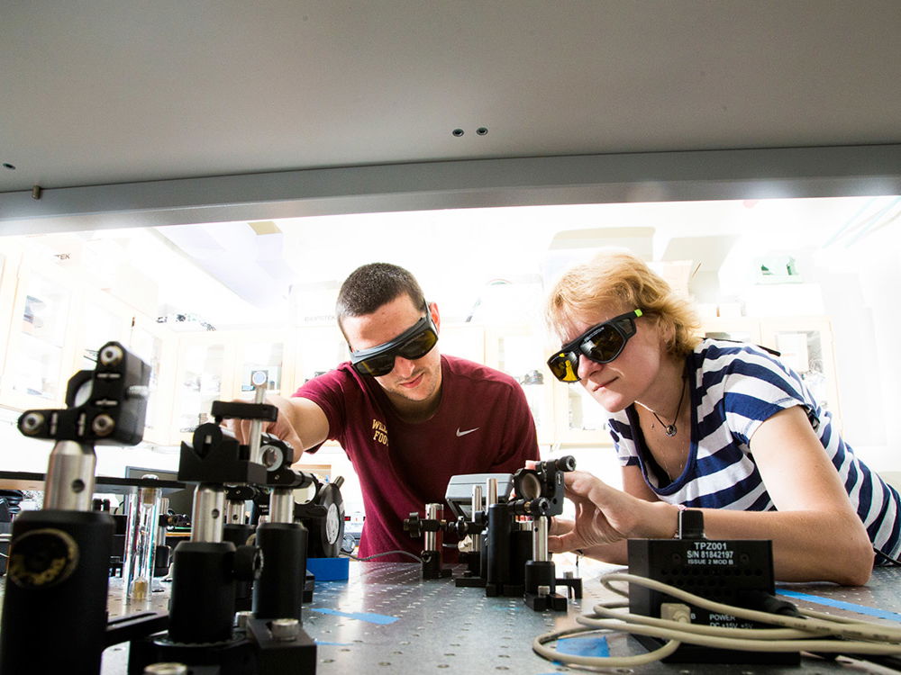 Two people completing research in a lab.