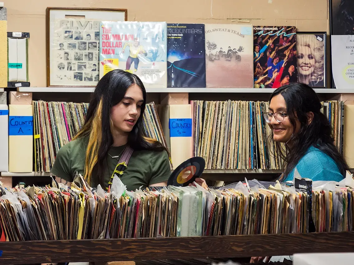 Two Willamette students shopping in a record store in Salem, Oregon