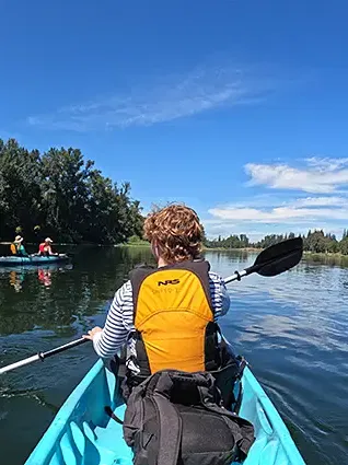 Willamette students kayaking in the Willamette River.