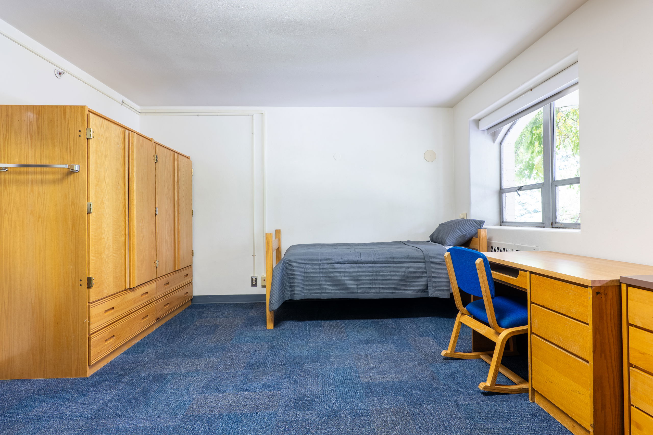 Doney double showing beds, closets, desks, and chairs