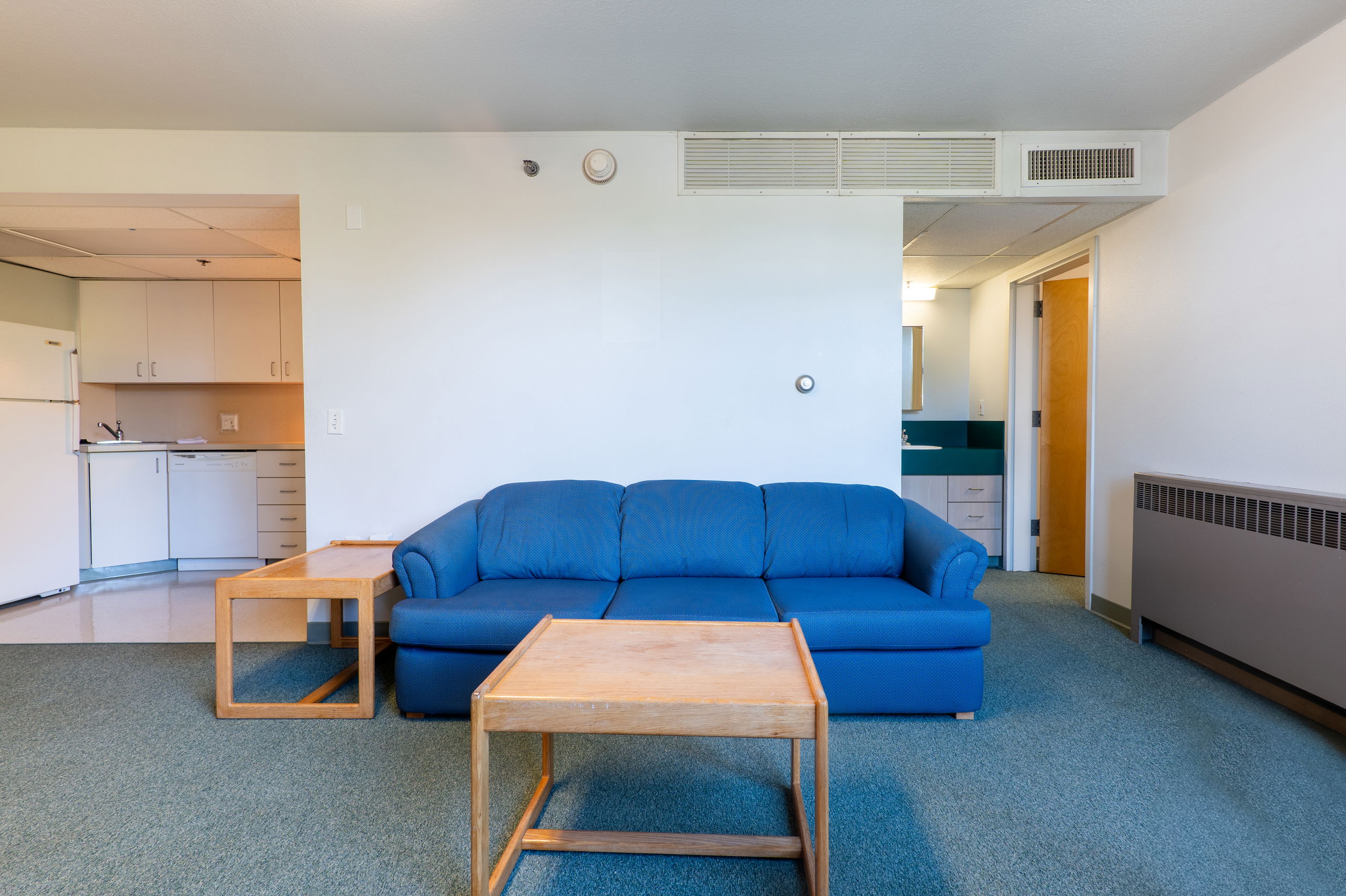 Living space with kitchen to the left and room to the right