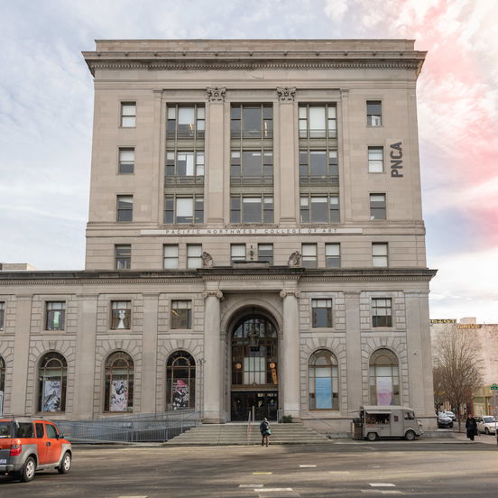 The Pacific Northwest College of Art in downtown Portland, a large white stone building at the intersection of a street