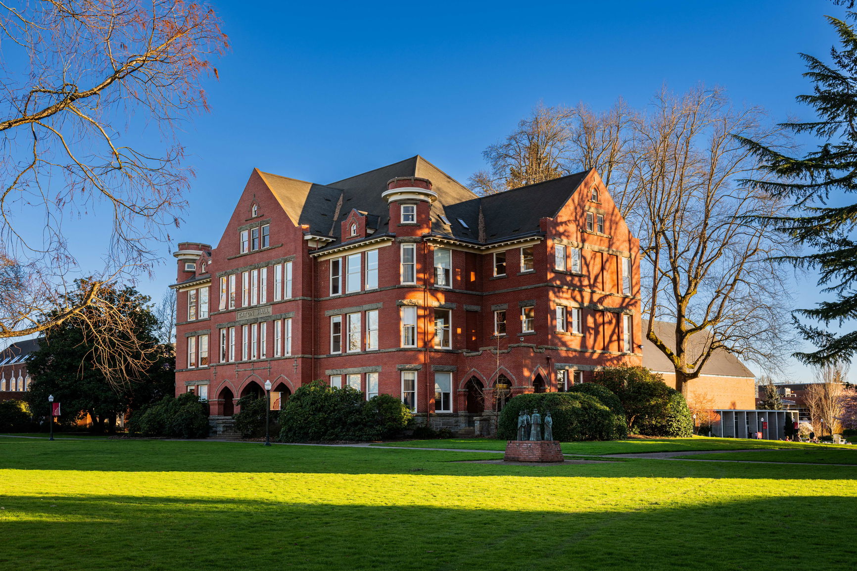 Willamette University's Eaton Hall, a Gothic-style red brick building with a grassy lawn