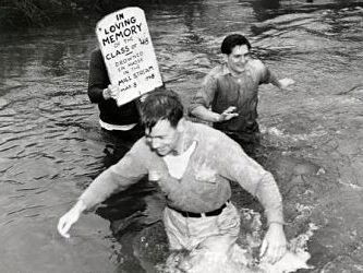 Black and White photo of a WU student crossing the stream