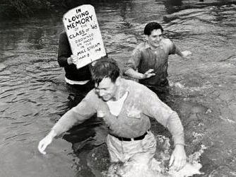 Black and White photo of a WU student crossing the stream