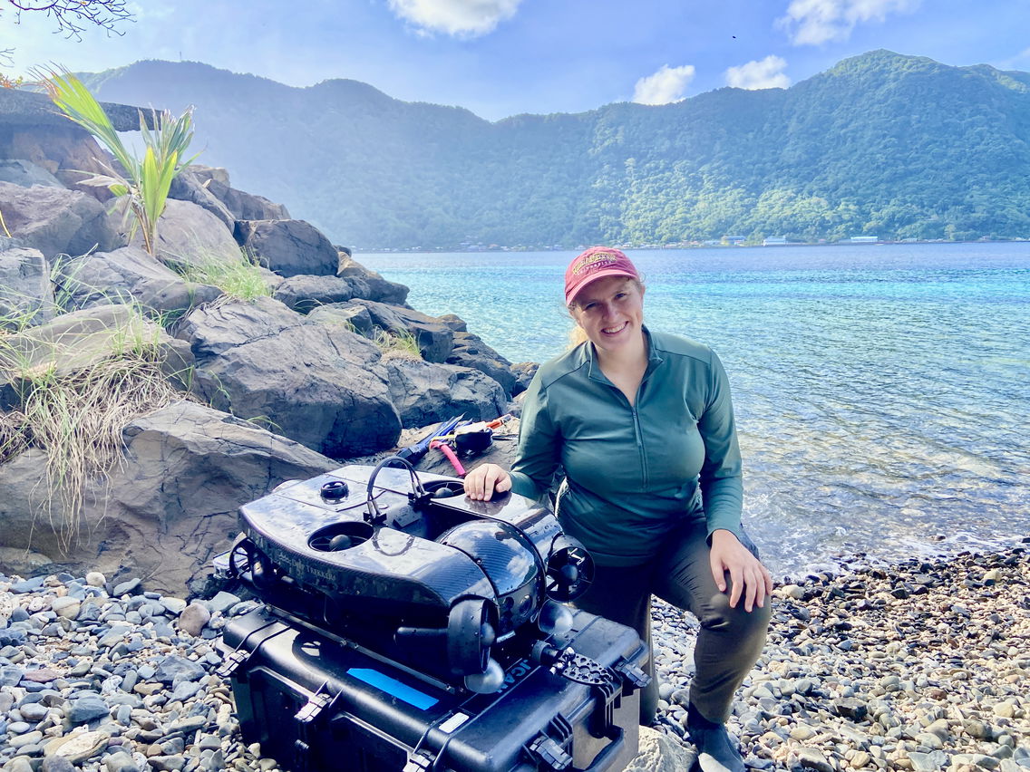 Ella poses with the National Marine Sanctuary of American Samoa’s ROV after a successful field operation using it to monitor 