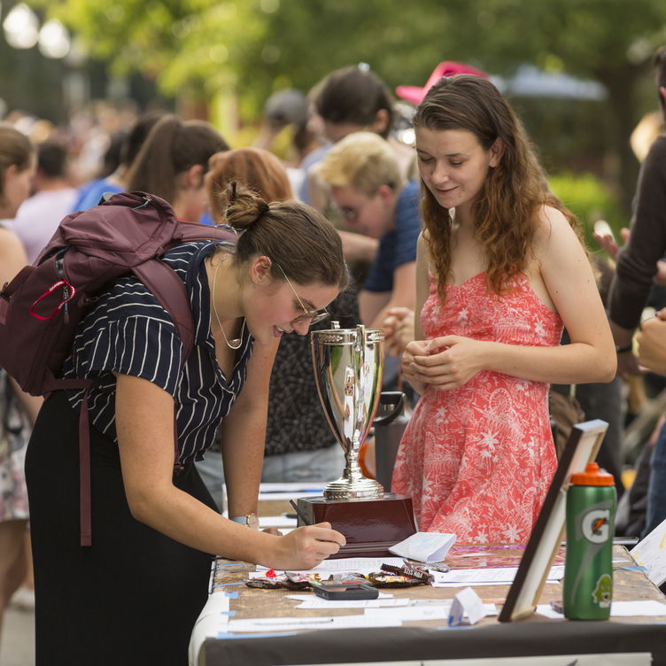 Students at a student org fair outside