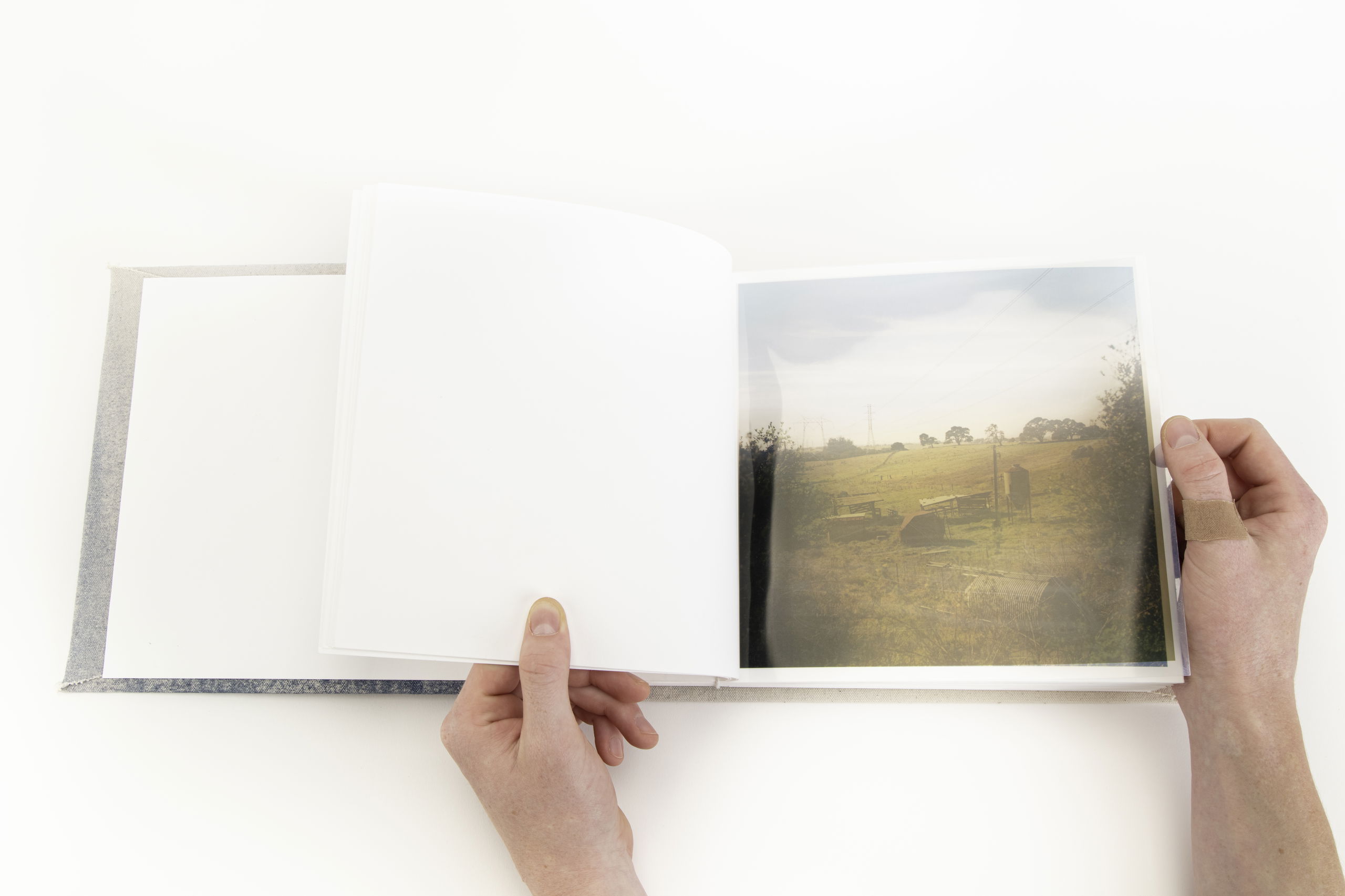 Image of someone holding holding a handmade book.