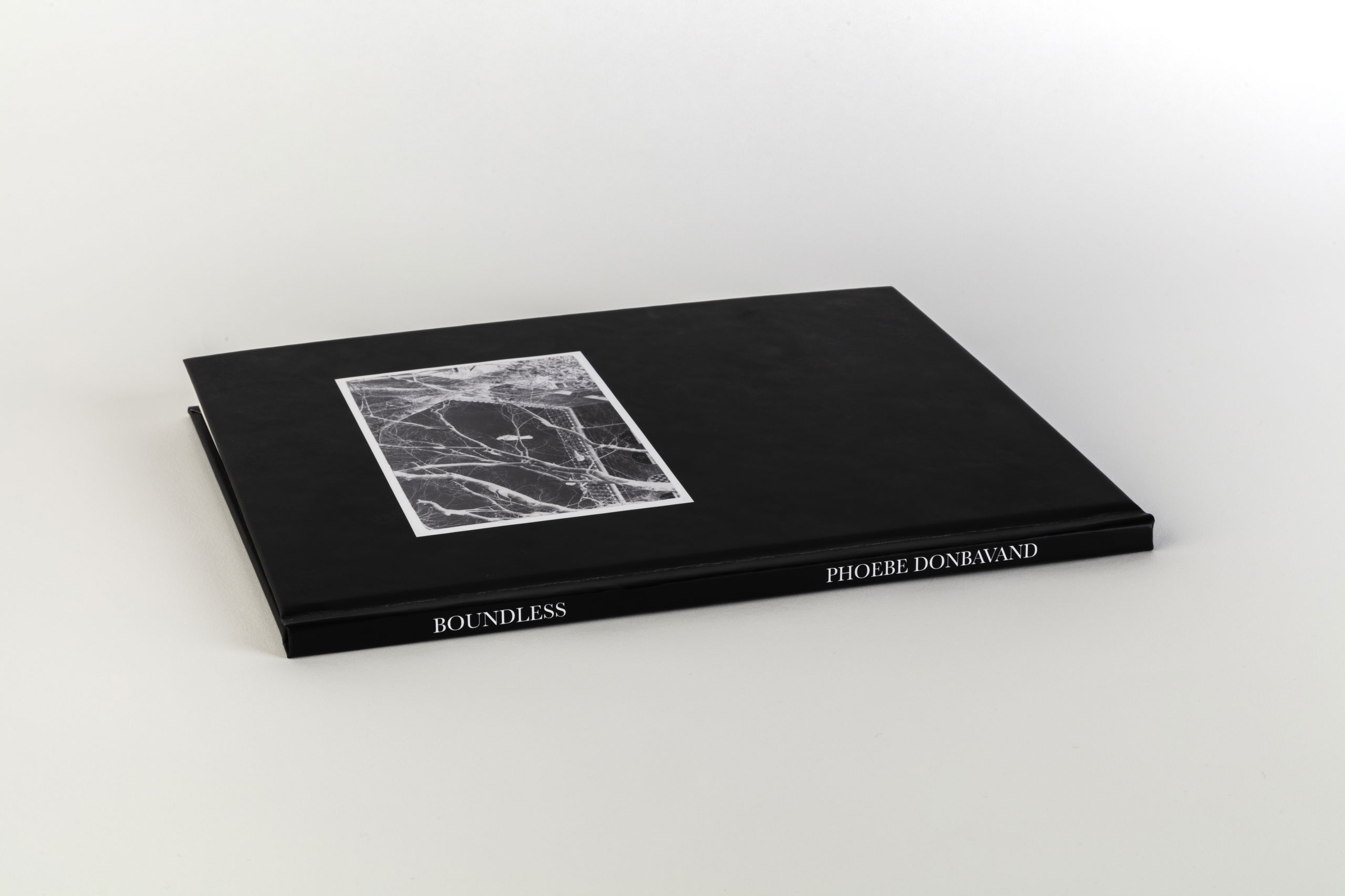 Image of a black book sitting on a table.