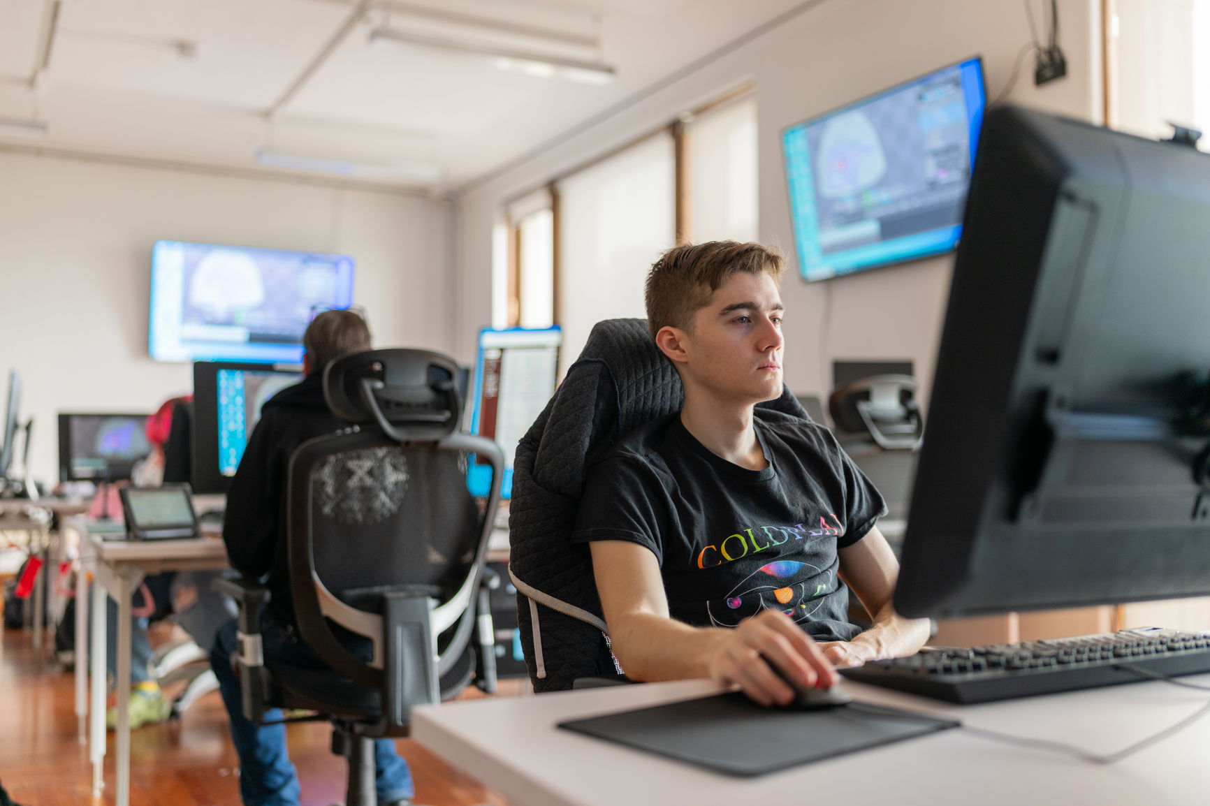 An overview of the cintiq lab with students working at the computers. 