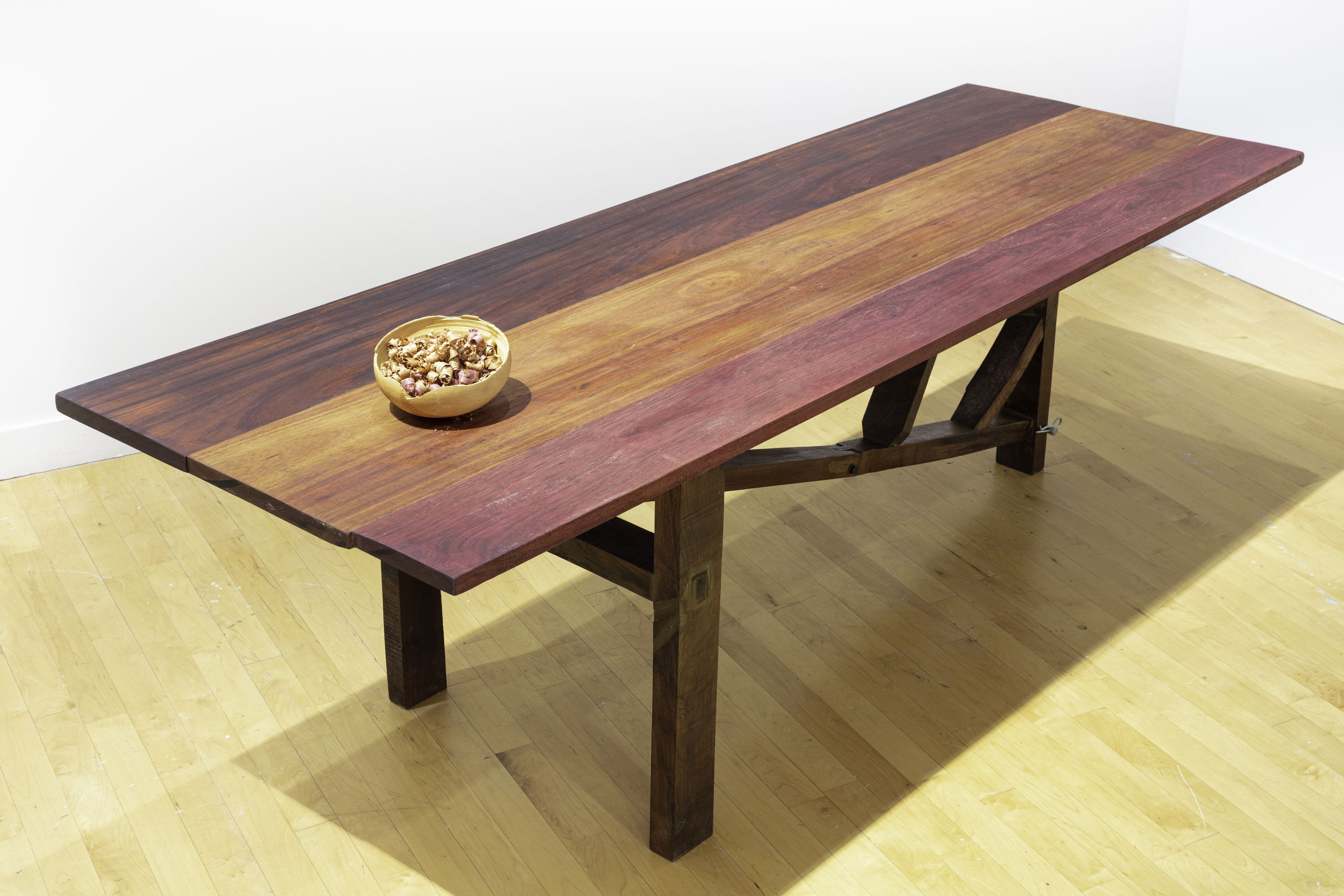 Wooden table in a room made by Megita Denton