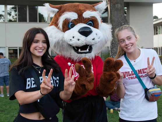 Students standing with the mascot Blitz at Opening Days