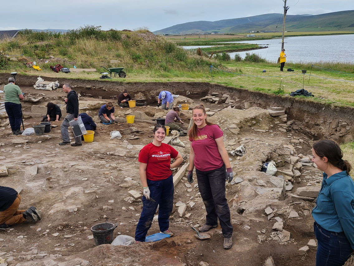 Two students on an archeological dig. 