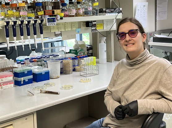 Rachel Dell sitting in the a lab at the Fred Hutchinson Cancer Center.