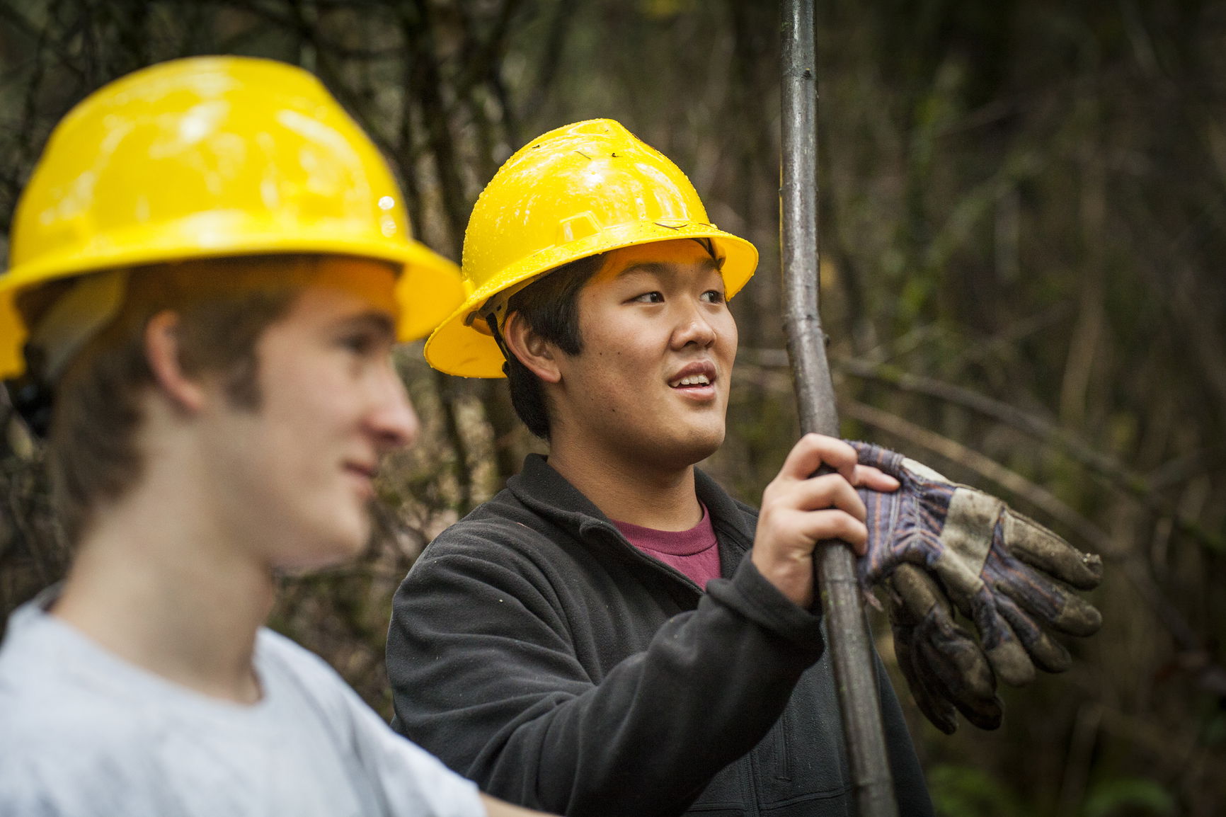 Two students work in Zena with hard hats on. 