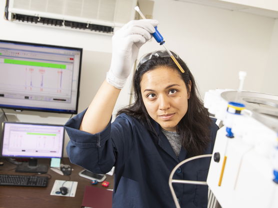 Anna Ayala working in a lab.