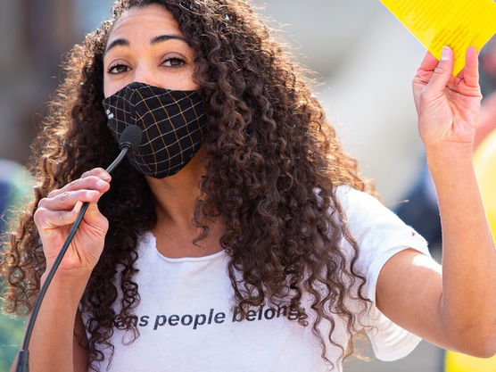 Akilah Deernose speaking at an event for the ACLU