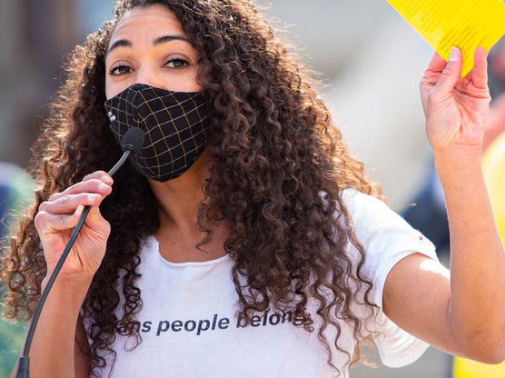 Akilah Deernose speaking at an event for the ACLU